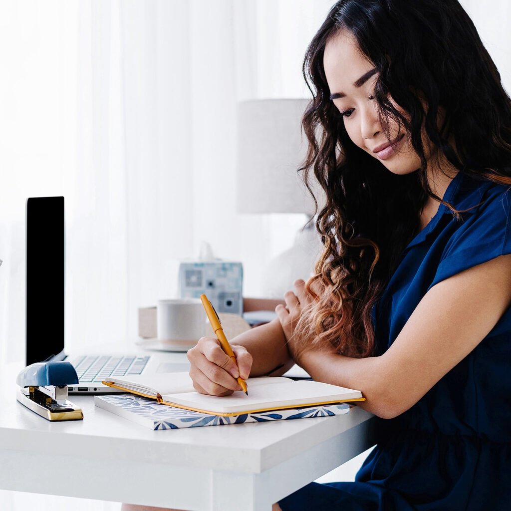 Woman writing in a goal